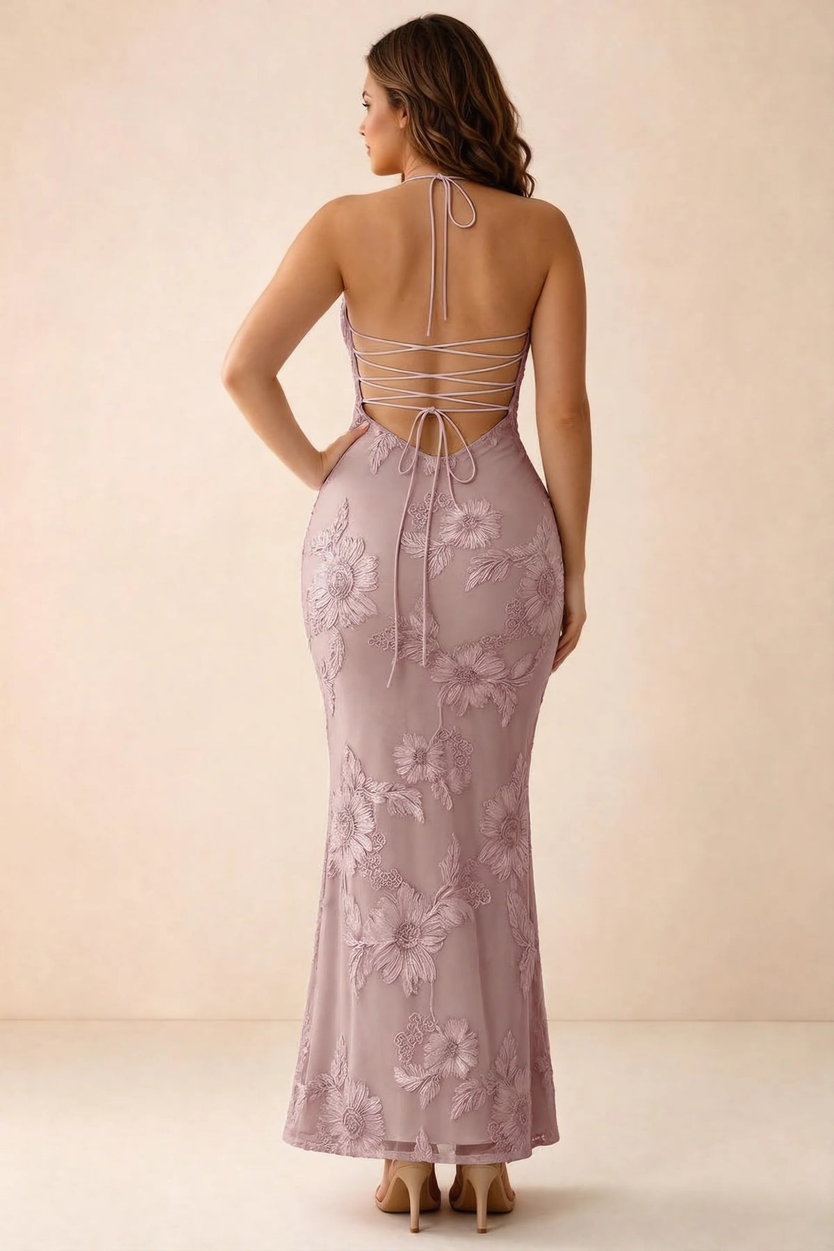 Rear studio view of Brigitte dusty lilac dress on a second model, showing the back lacing and long skirt