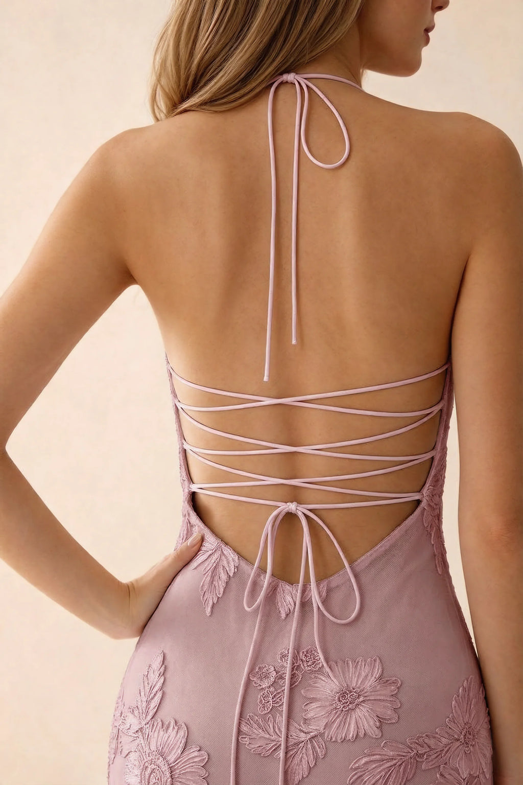 Close-up of Brigitte dusty lilac neck tie and crossed lacing across the open back