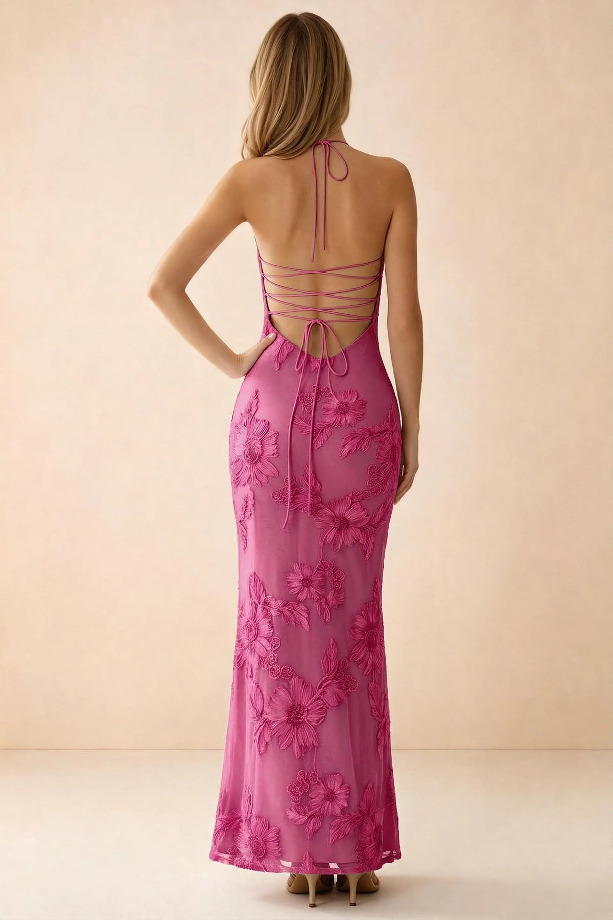 Rear studio view of Brigitte fuchsia dress showing crossed lacing across the low open back