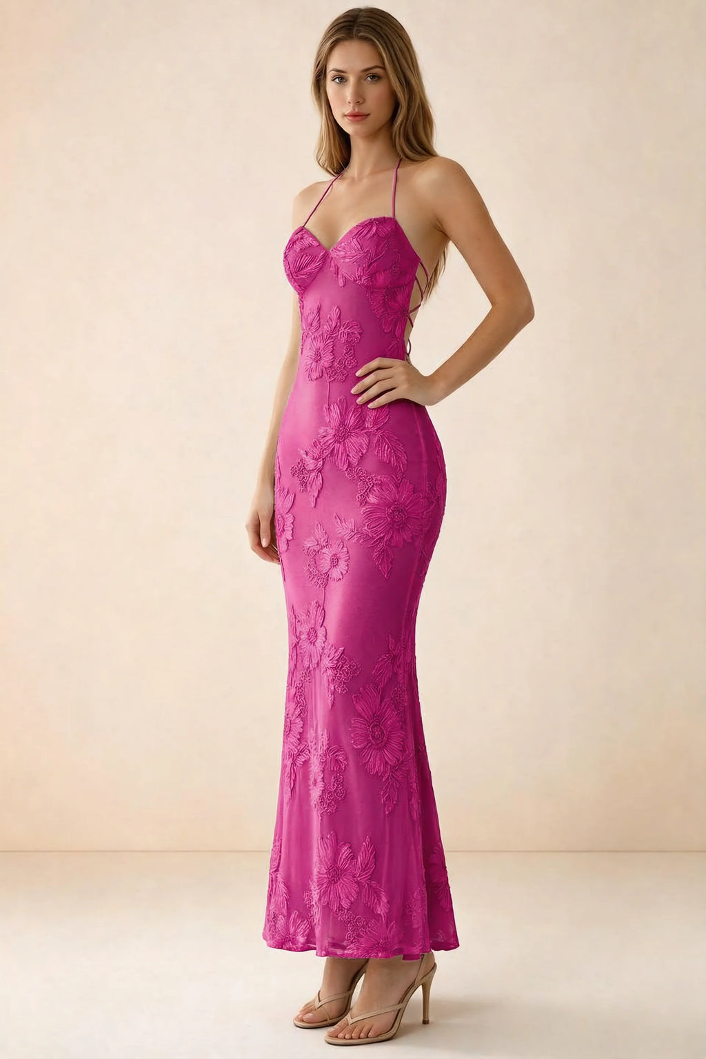 Three-quarter studio view of Brigitte fuchsia dress showing the fitted hips and ankle-skimming hem