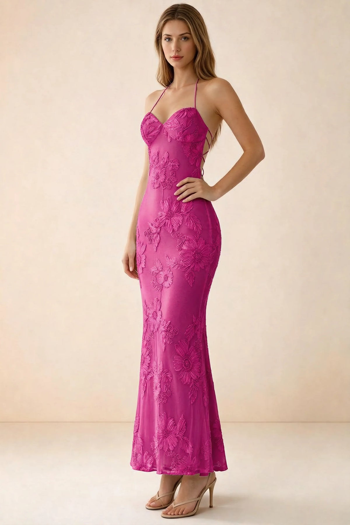 Three-quarter studio view of Brigitte fuchsia dress showing the fitted hips and ankle-skimming hem