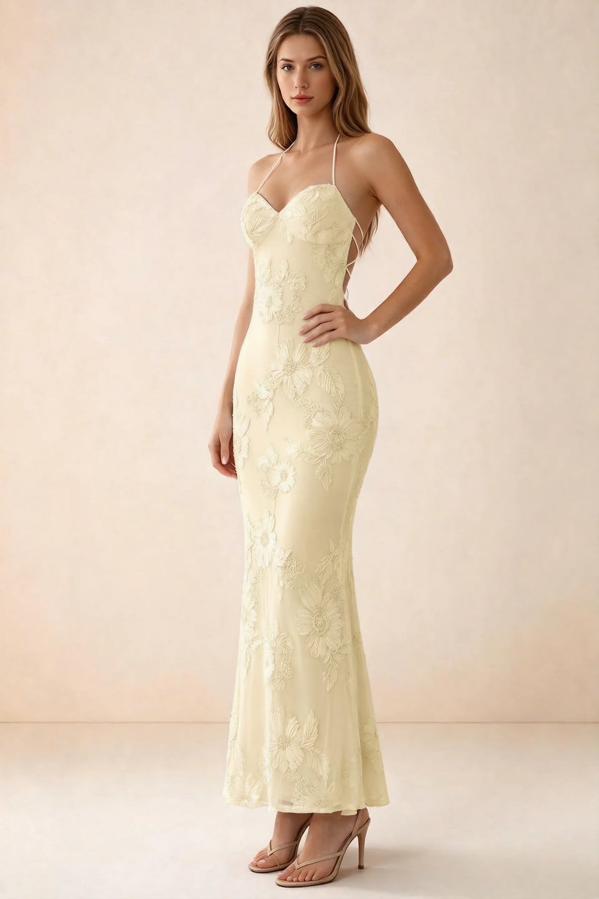 Three-quarter studio view of Brigitte lemon dress showing the fitted hips and ankle-skimming hem