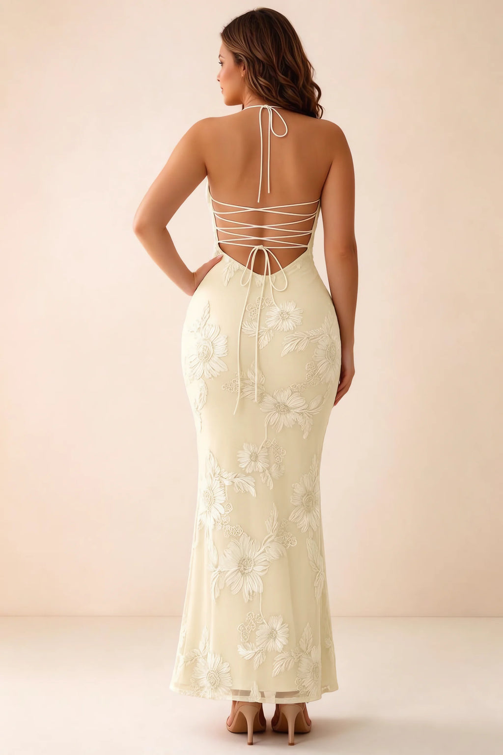 Rear studio view of Brigitte lemon dress on a second model, showing the back lacing and long skirt