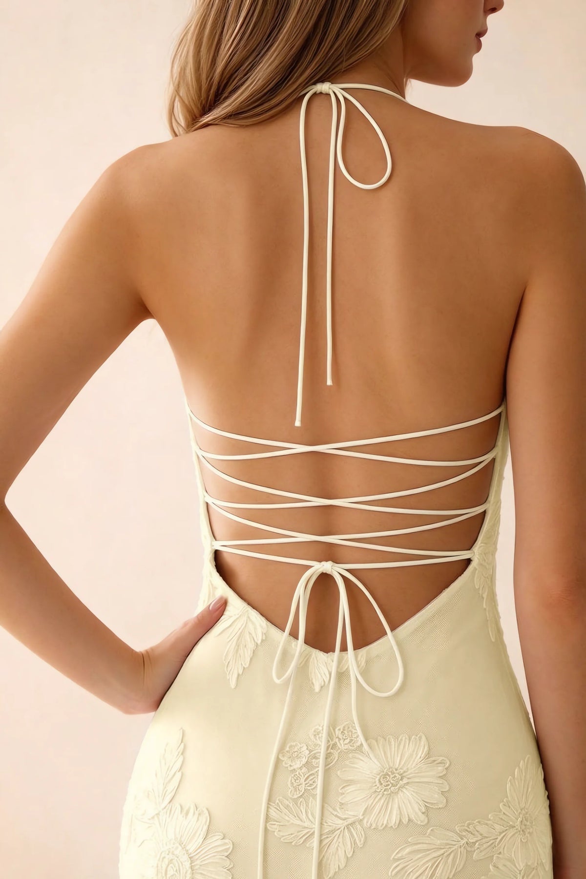 Close-up of Brigitte lemon neck tie and crossed lacing across the open back