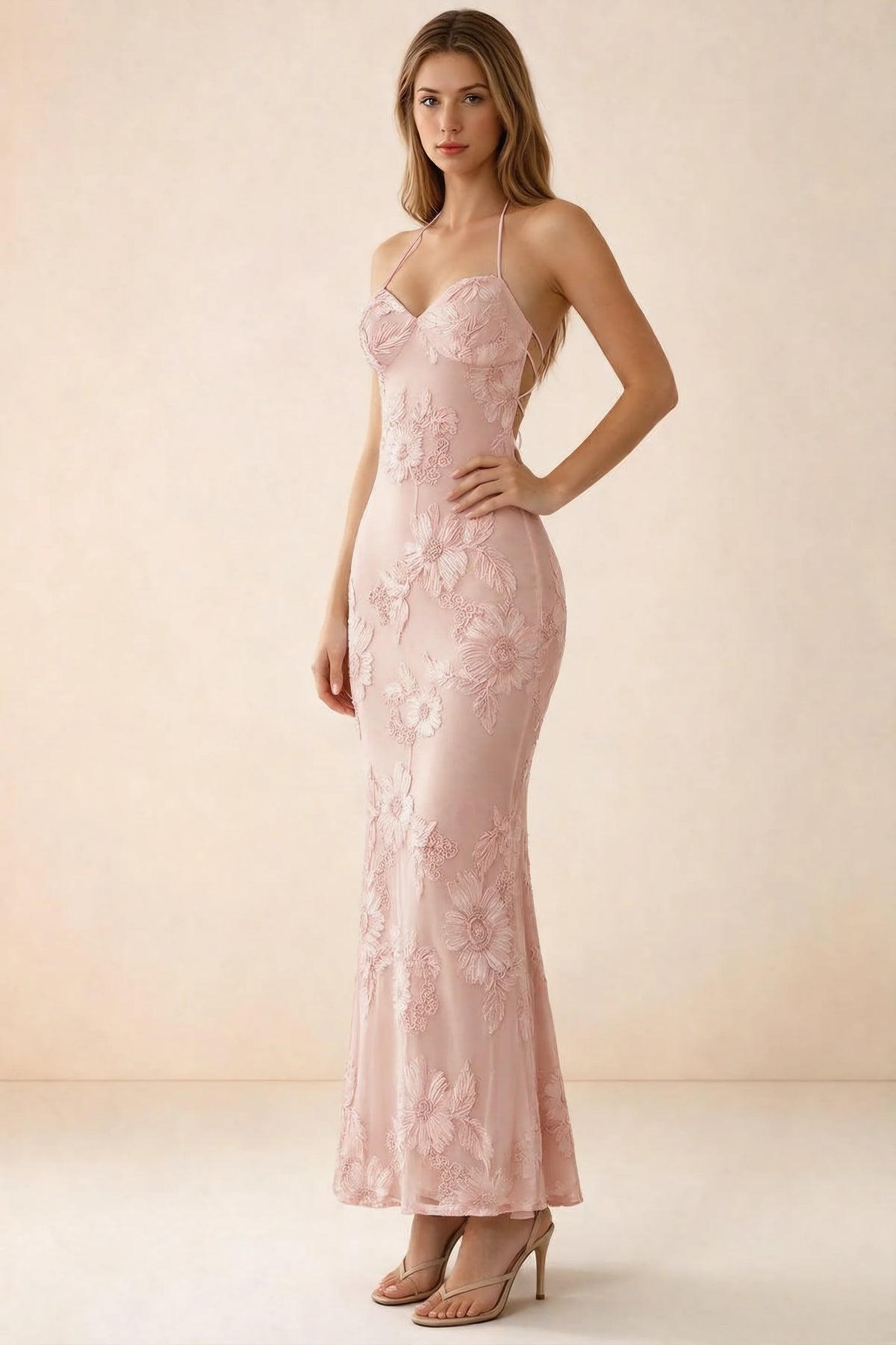 Three-quarter studio view of Brigitte light pink dress showing the fitted hips and ankle-skimming hem
