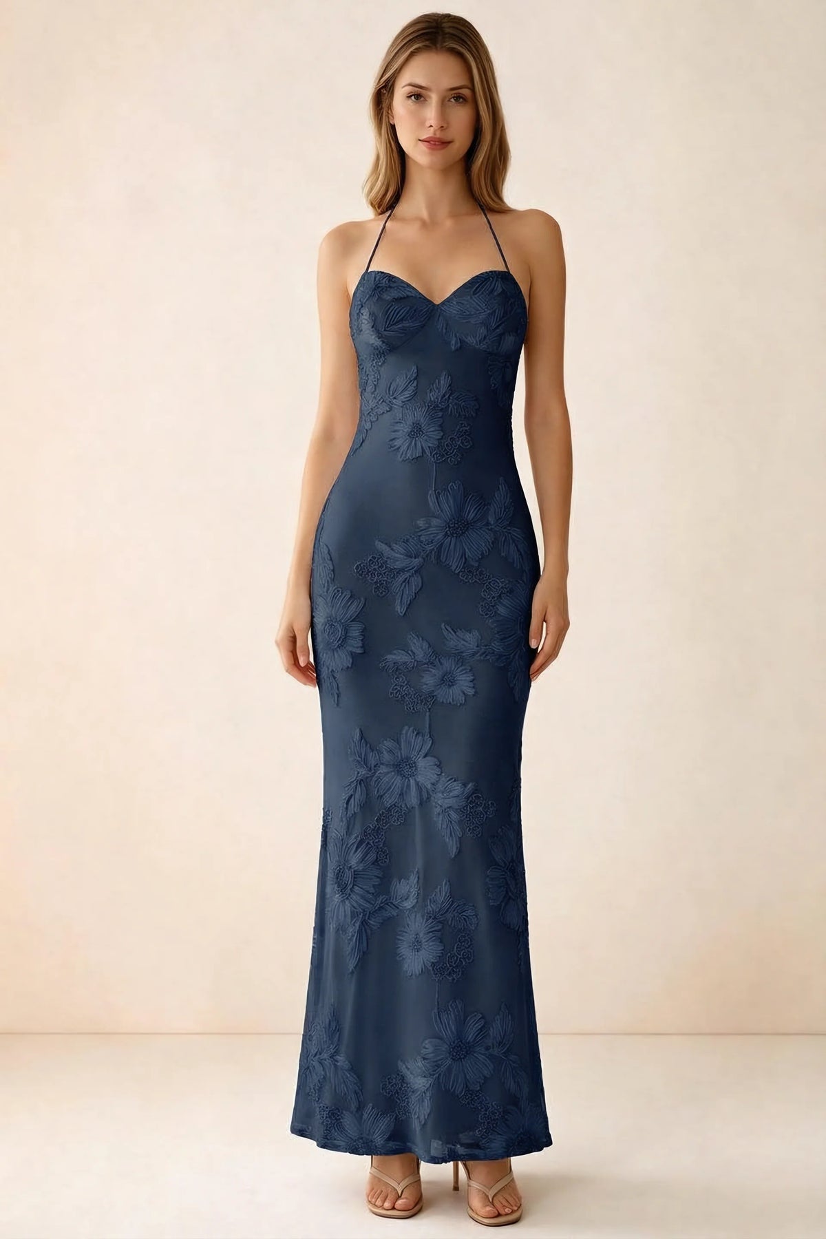 Front studio view of Brigitte navy floral maxi dress with sweetheart neckline and fine halter ties