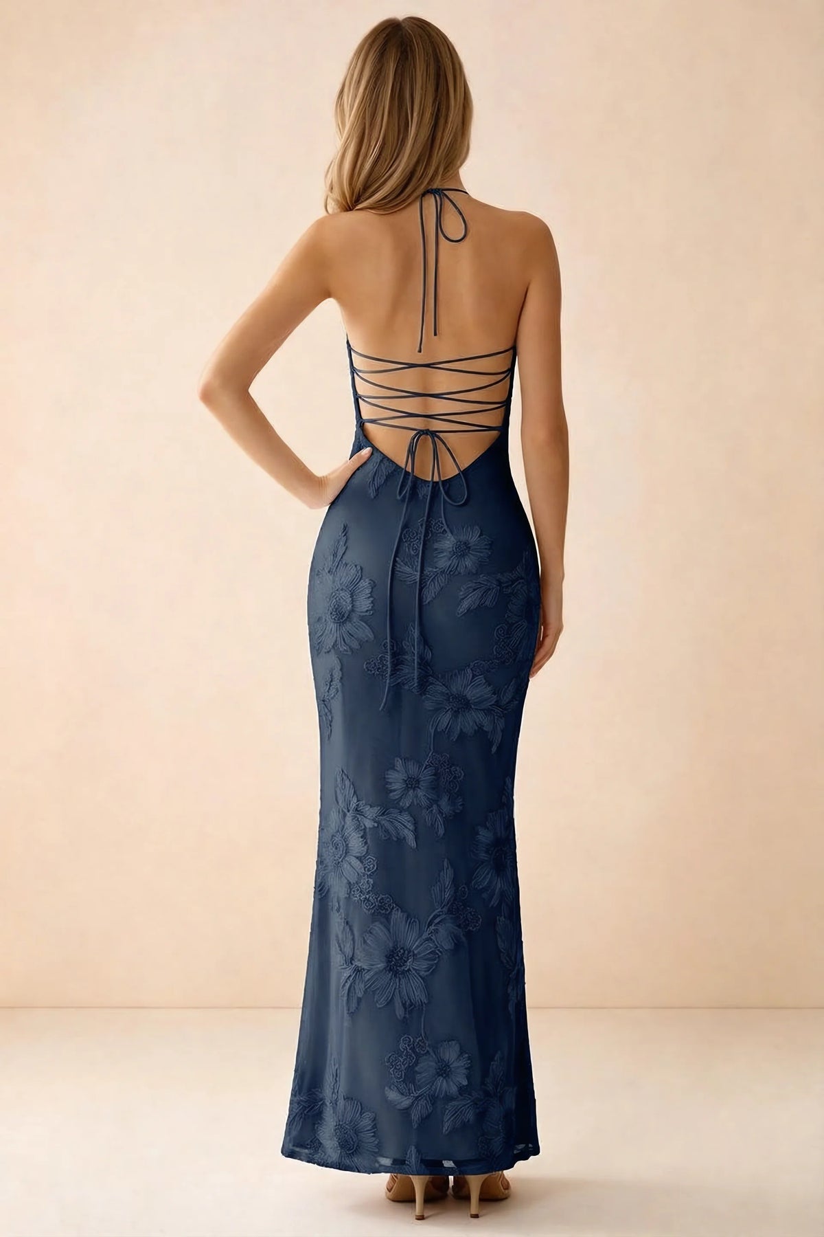 Rear studio view of Brigitte navy dress showing crossed lacing across the low open back
