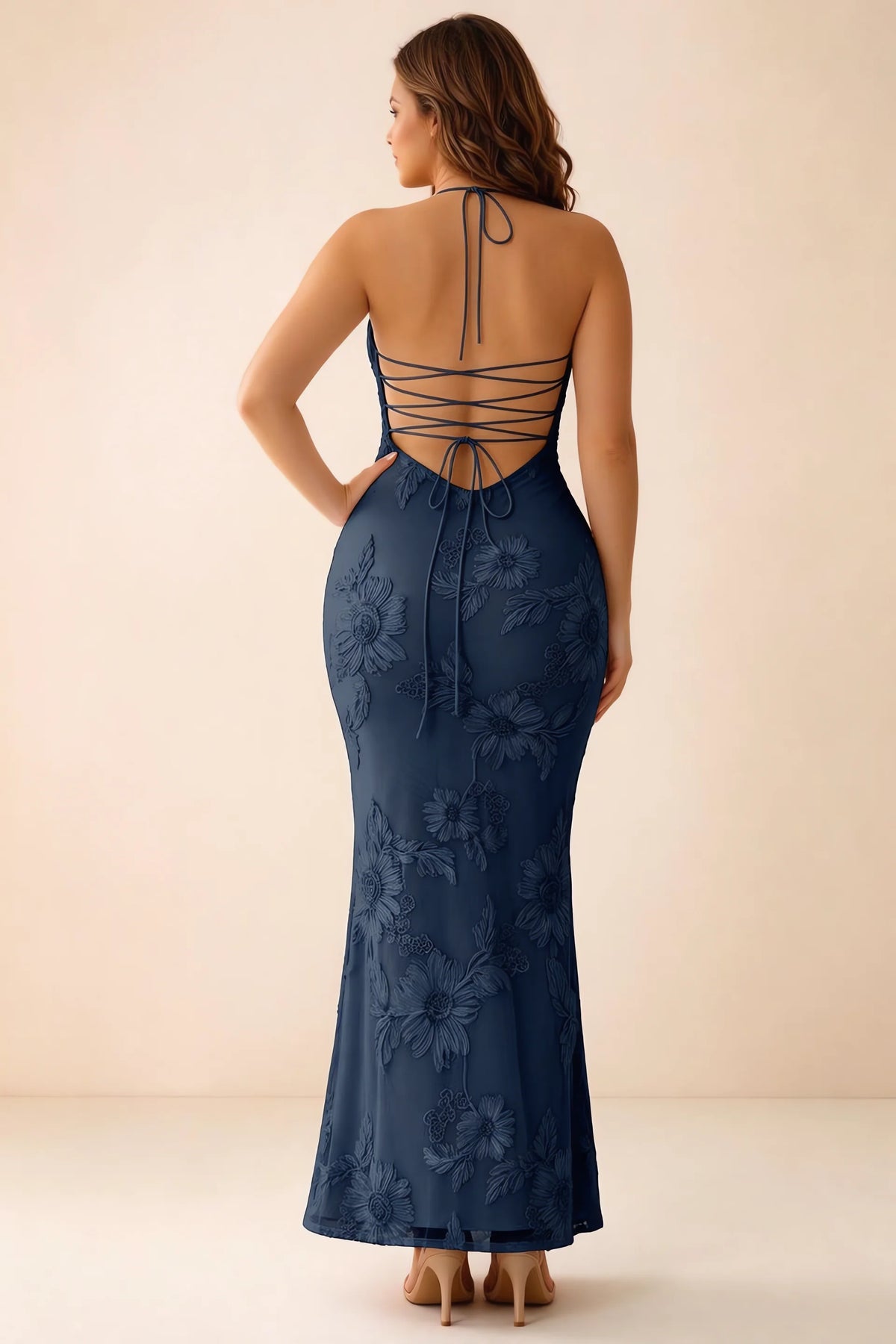 Rear studio view of Brigitte navy dress on a second model, showing the back lacing and long skirt