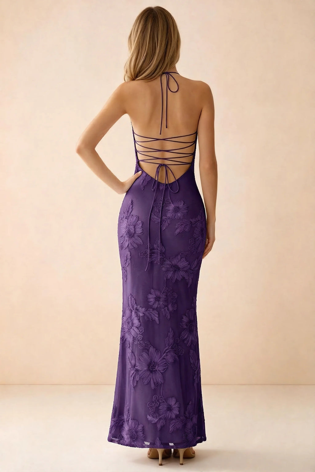 Rear studio view of Brigitte plum dress showing crossed lacing across the low open back