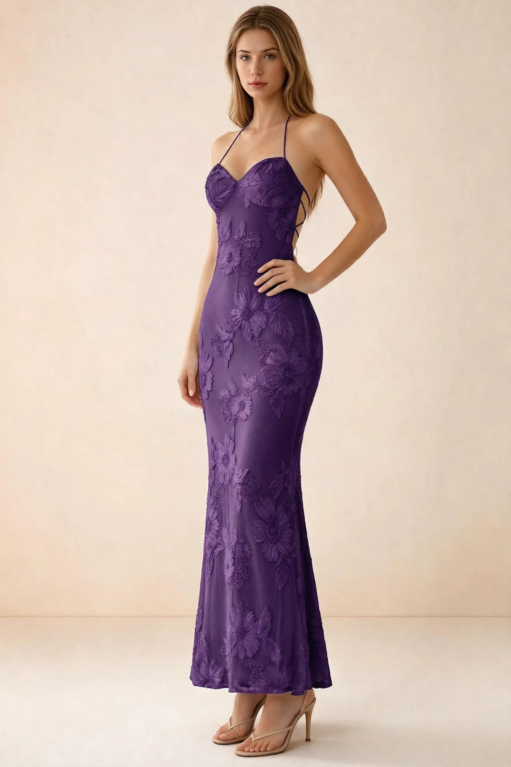Three-quarter studio view of Brigitte plum dress showing the fitted hips and ankle-skimming hem