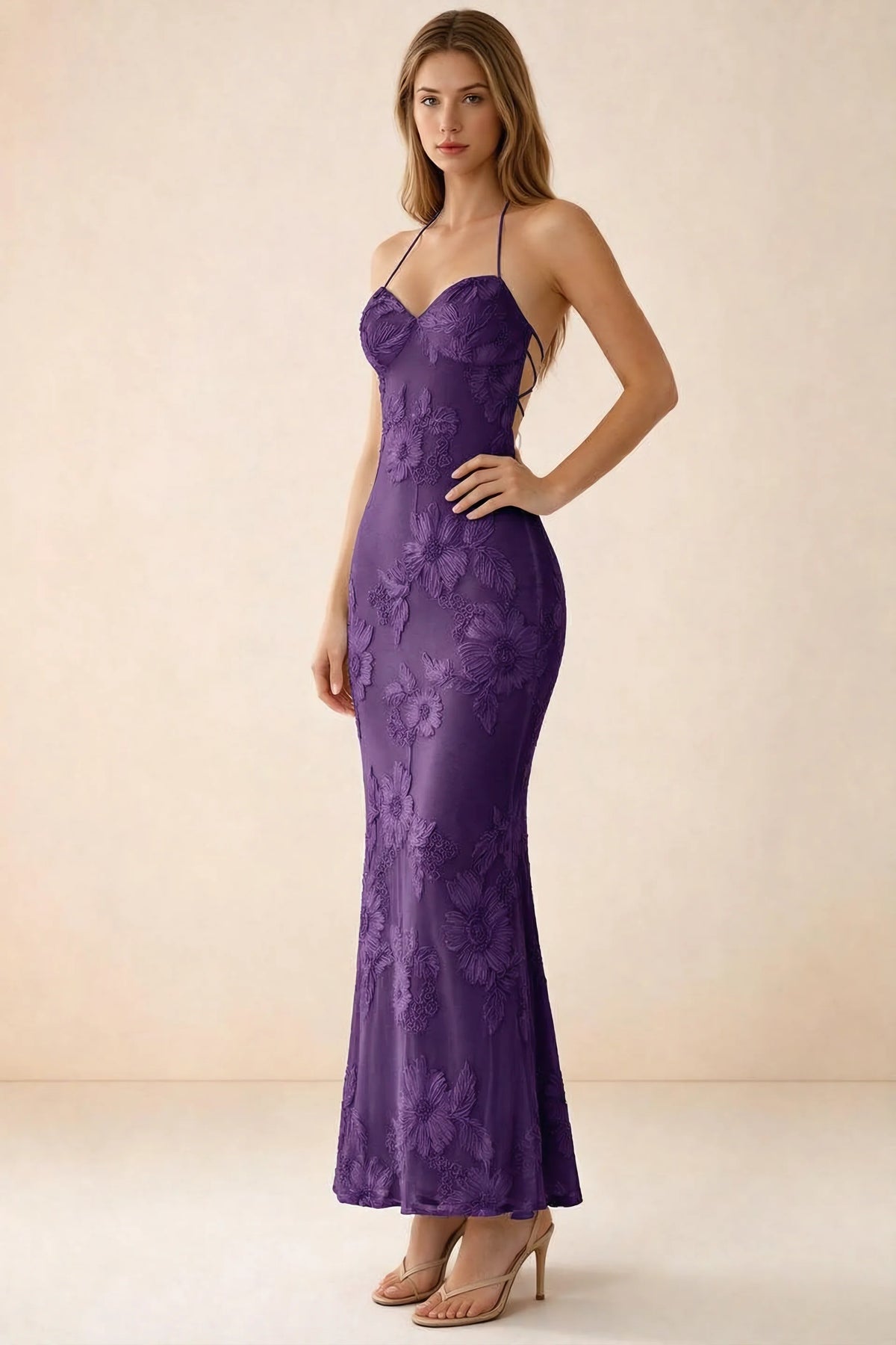 Three-quarter studio view of Brigitte plum dress showing the fitted hips and ankle-skimming hem