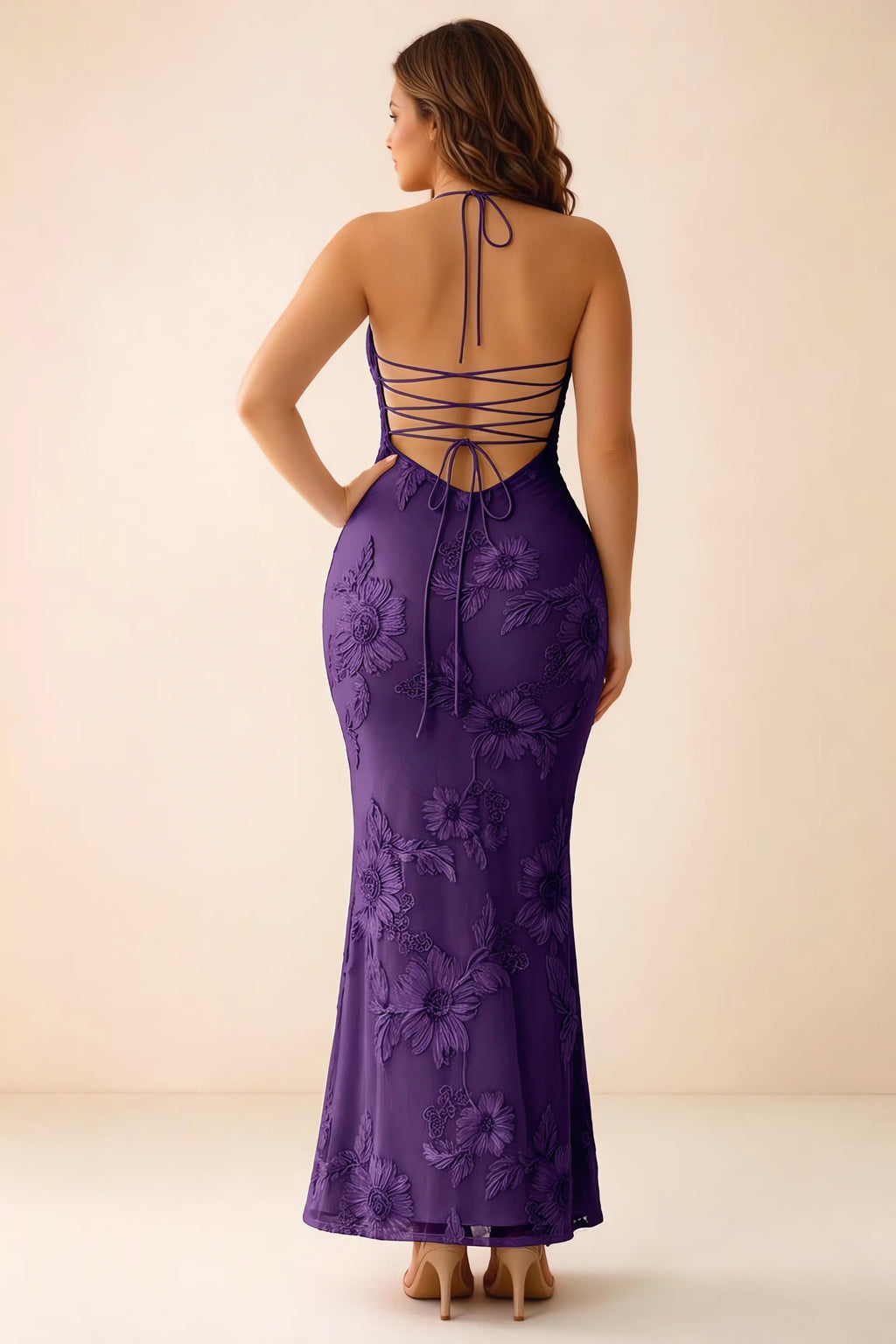 Rear studio view of Brigitte plum dress on a second model, showing the back lacing and long skirt