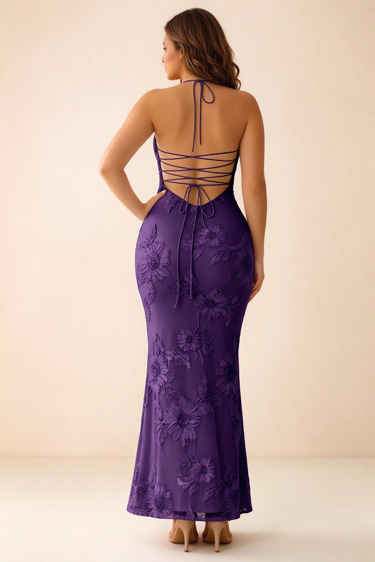 Rear studio view of Brigitte plum dress on a second model, showing the back lacing and long skirt