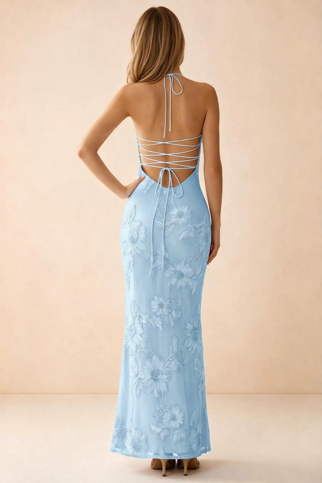 Rear studio view of Brigitte sky blue dress showing crossed lacing across the low open back