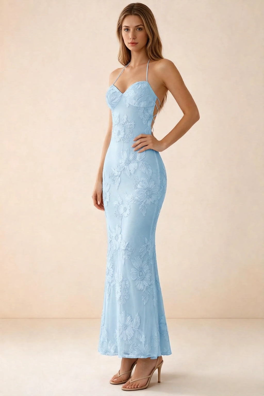 Three-quarter studio view of Brigitte sky blue dress showing the fitted hips and ankle-skimming hem