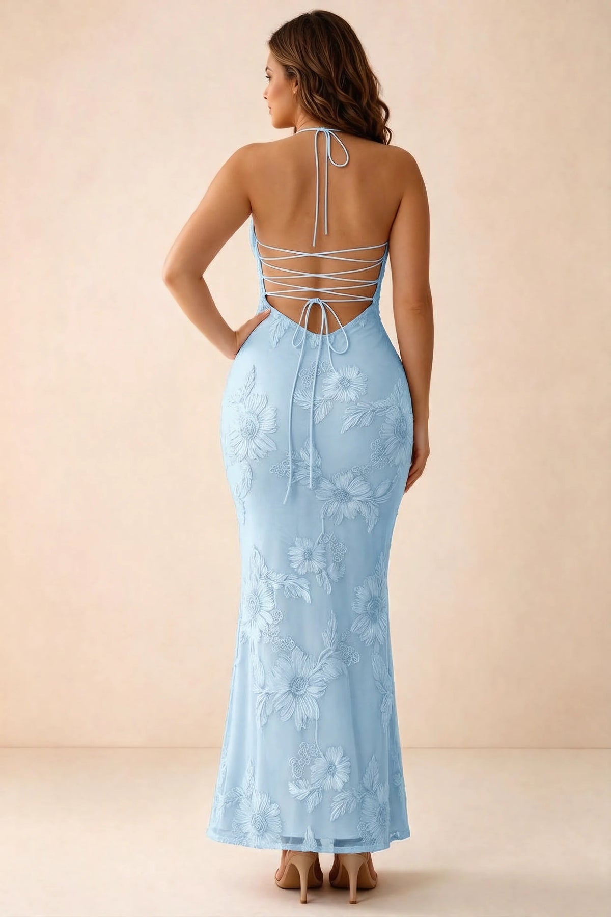 Rear studio view of Brigitte sky blue dress on a second model, showing the back lacing and long skirt