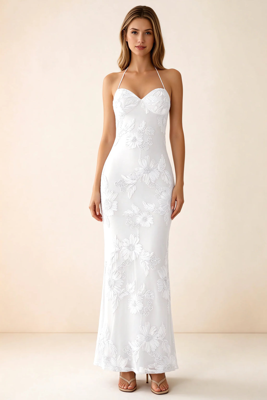 Front studio view of Brigitte white floral maxi dress with sweetheart neckline and fine halter ties