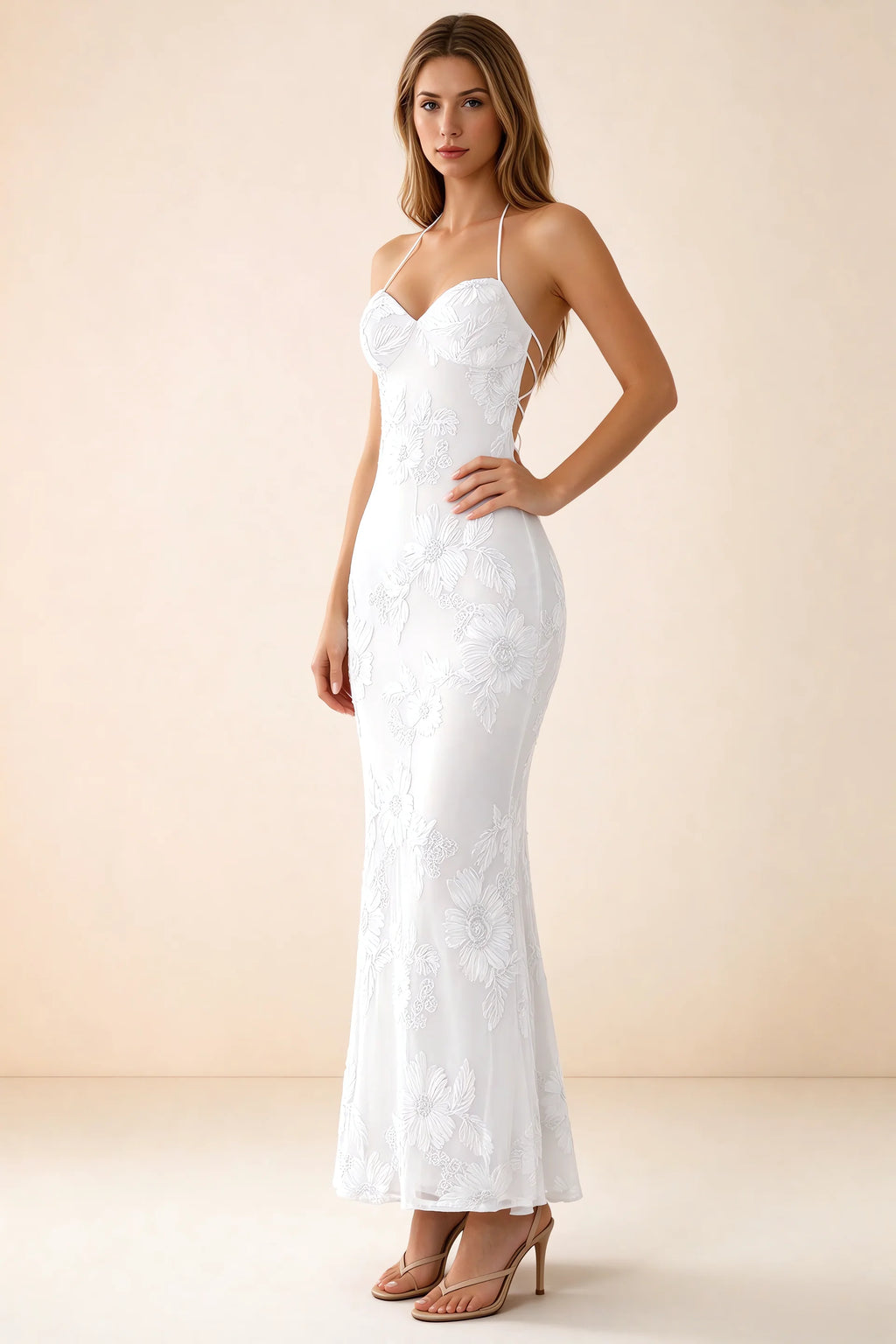 Three-quarter studio view of Brigitte white dress showing the fitted hips and ankle-skimming hem