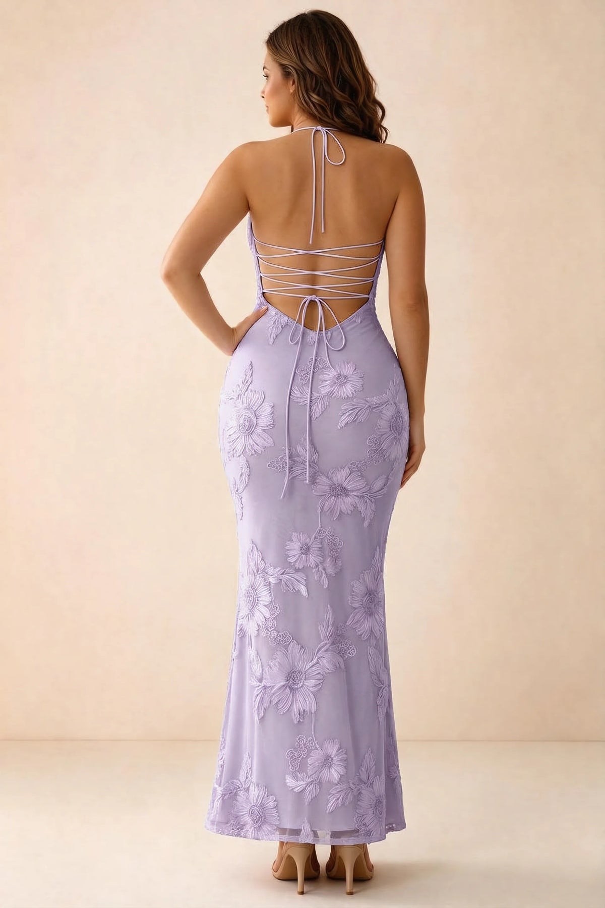 Rear studio view of Brigitte wisteria dress on a second model, showing the back lacing and long skirt