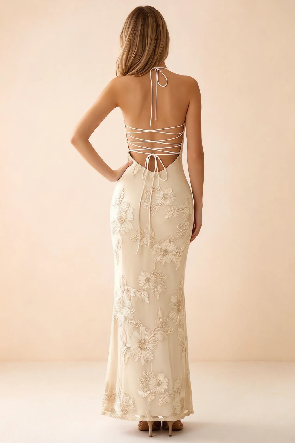 Rear studio view of Brigitte yellow dress showing crossed lacing across the low open back