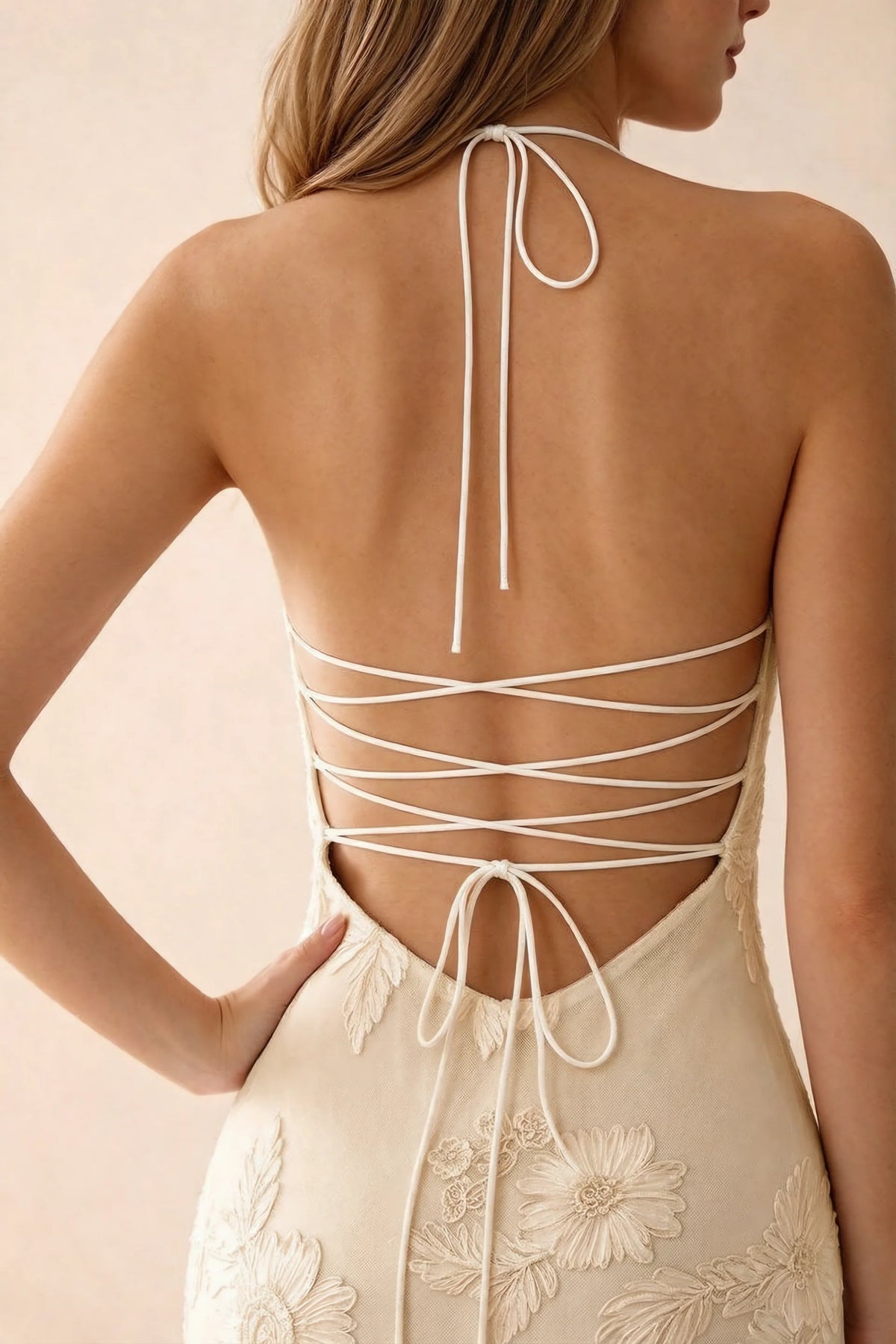Close-up of Brigitte yellow neck tie and crossed lacing across the open back