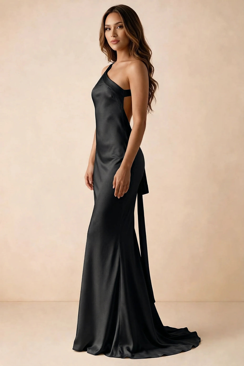 Side studio view of Brittany black dress showing the flared skirt and side-back tie