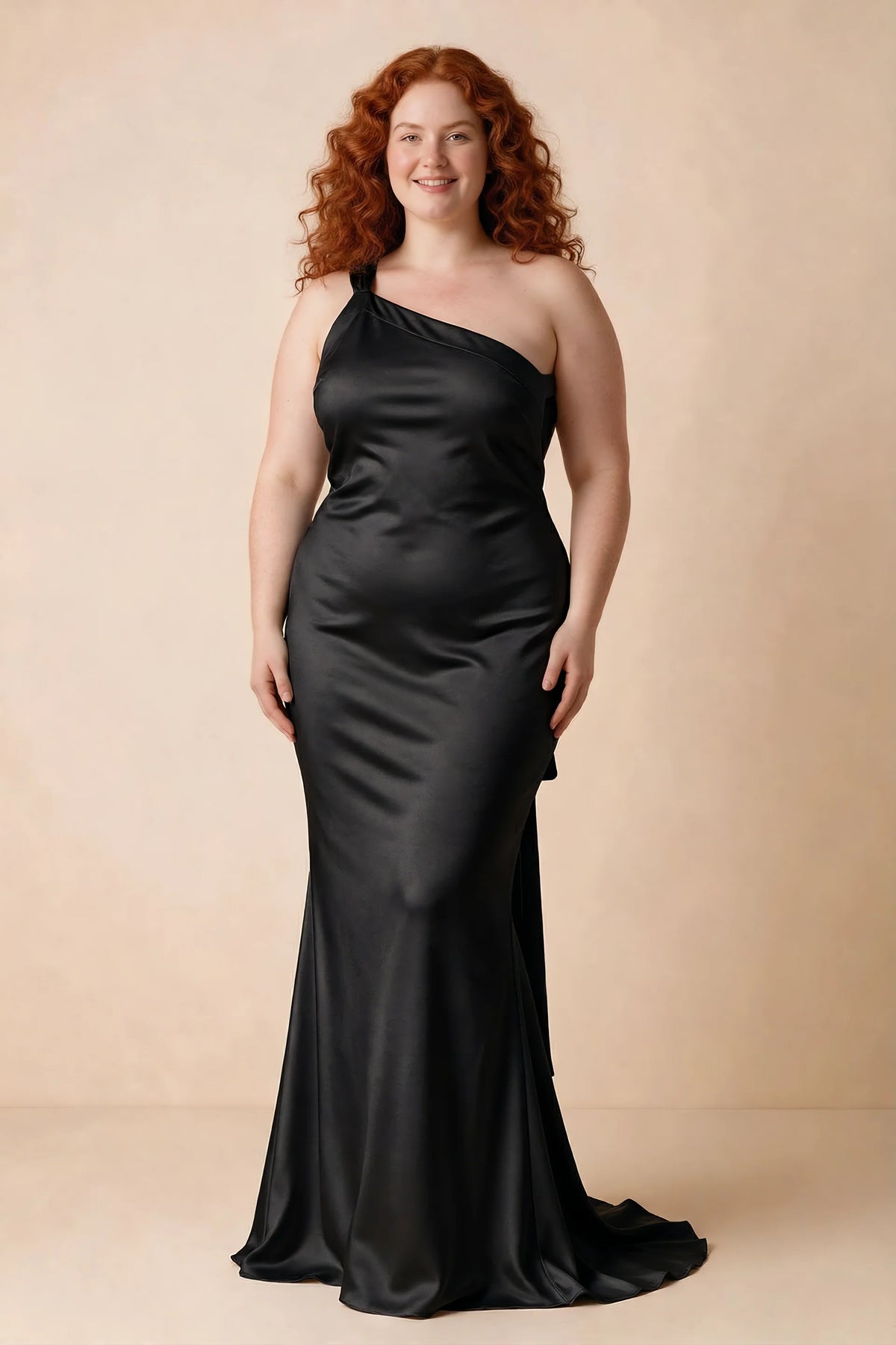 Front studio view of Brittany black dress on a second model, showing the asymmetric neckline