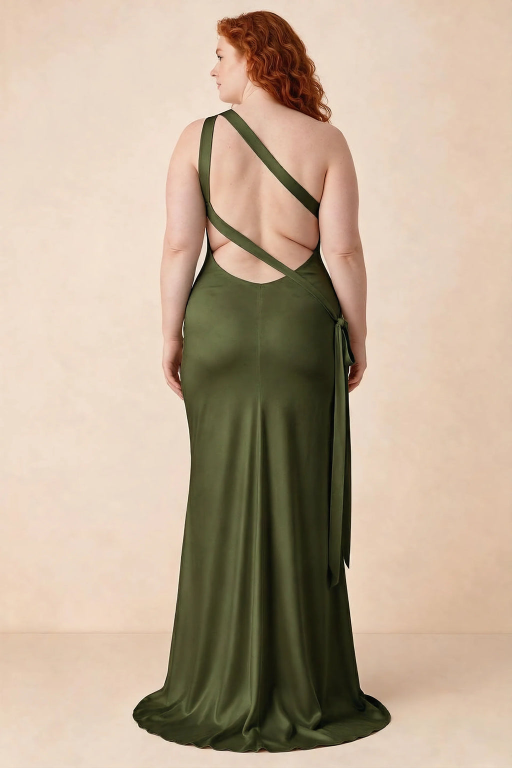 Rear studio view of Brittany olive dress on a second model, showing the crossing straps and flared hem