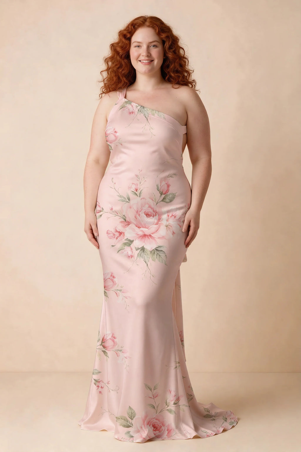 Front studio view of Brittany pink floral dress on a second model, showing the asymmetric neckline