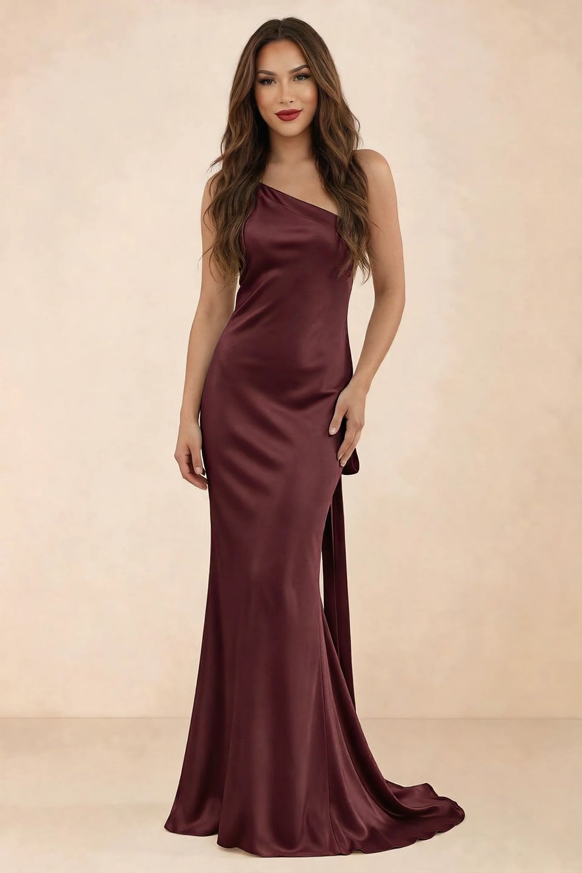 Front studio view of Brittany wine one-shoulder maxi dress with fitted waist and mermaid hem