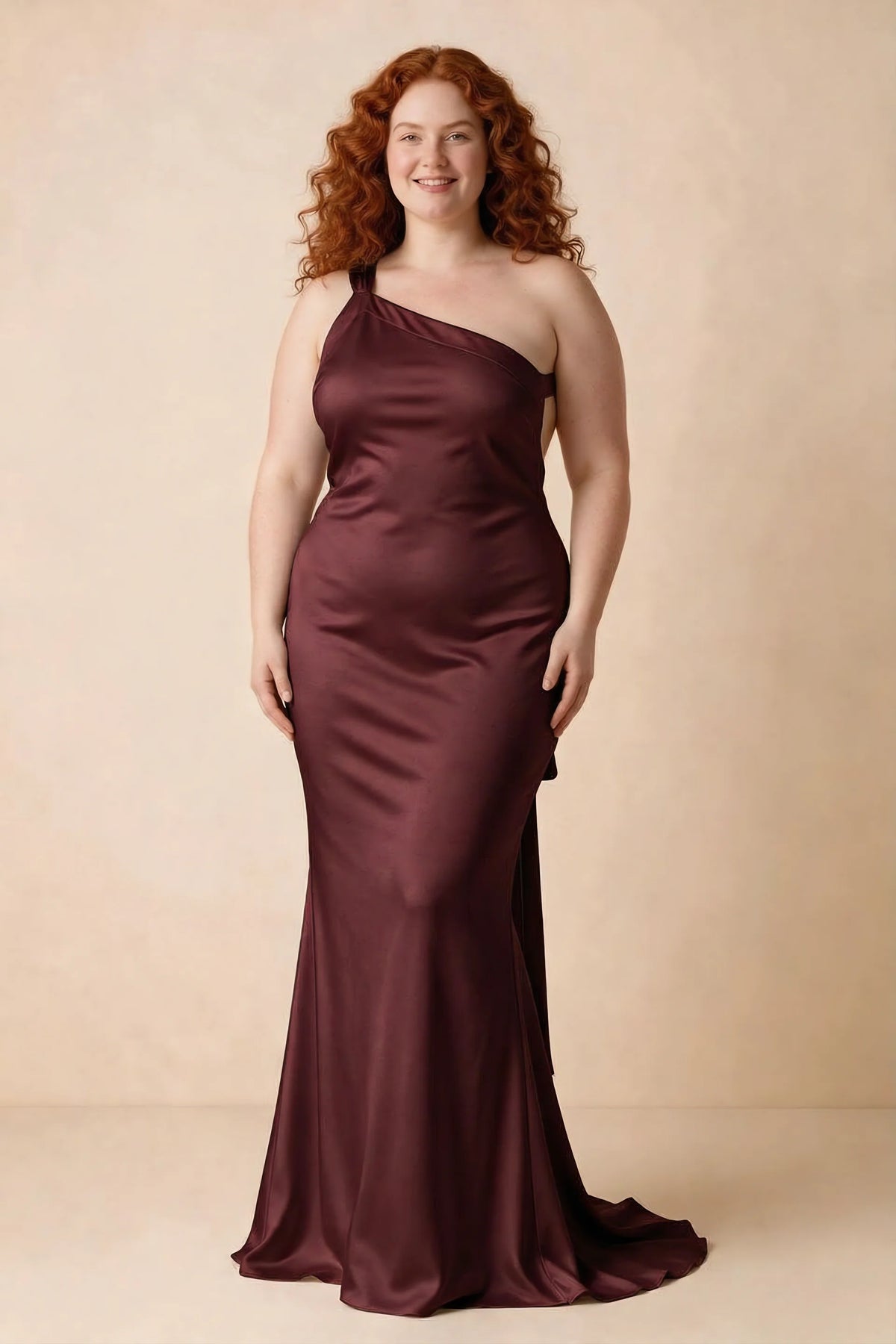 Front studio view of Brittany wine dress on a second model, showing the asymmetric neckline