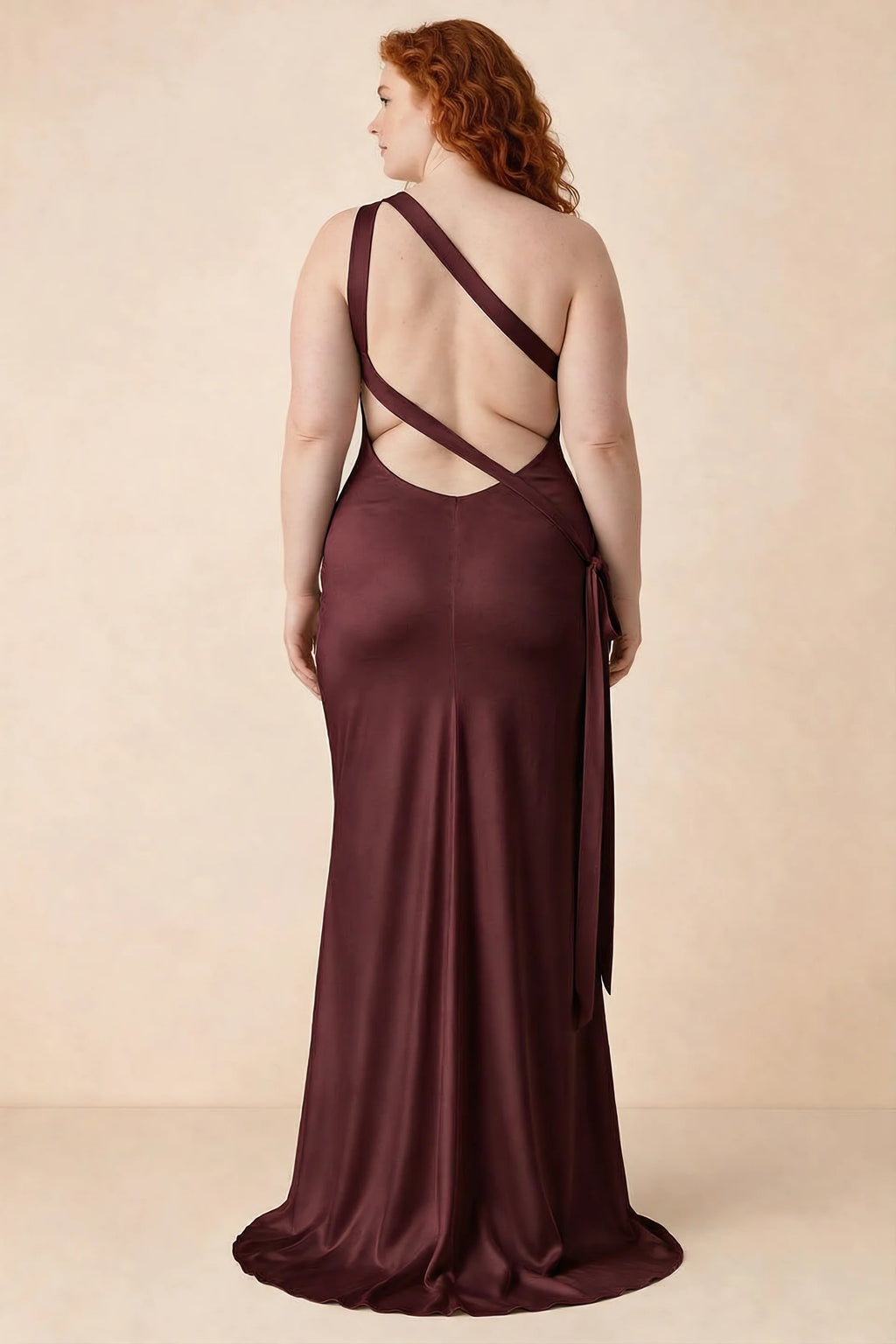 Rear studio view of Brittany wine dress on a second model, showing the crossing straps and flared hem