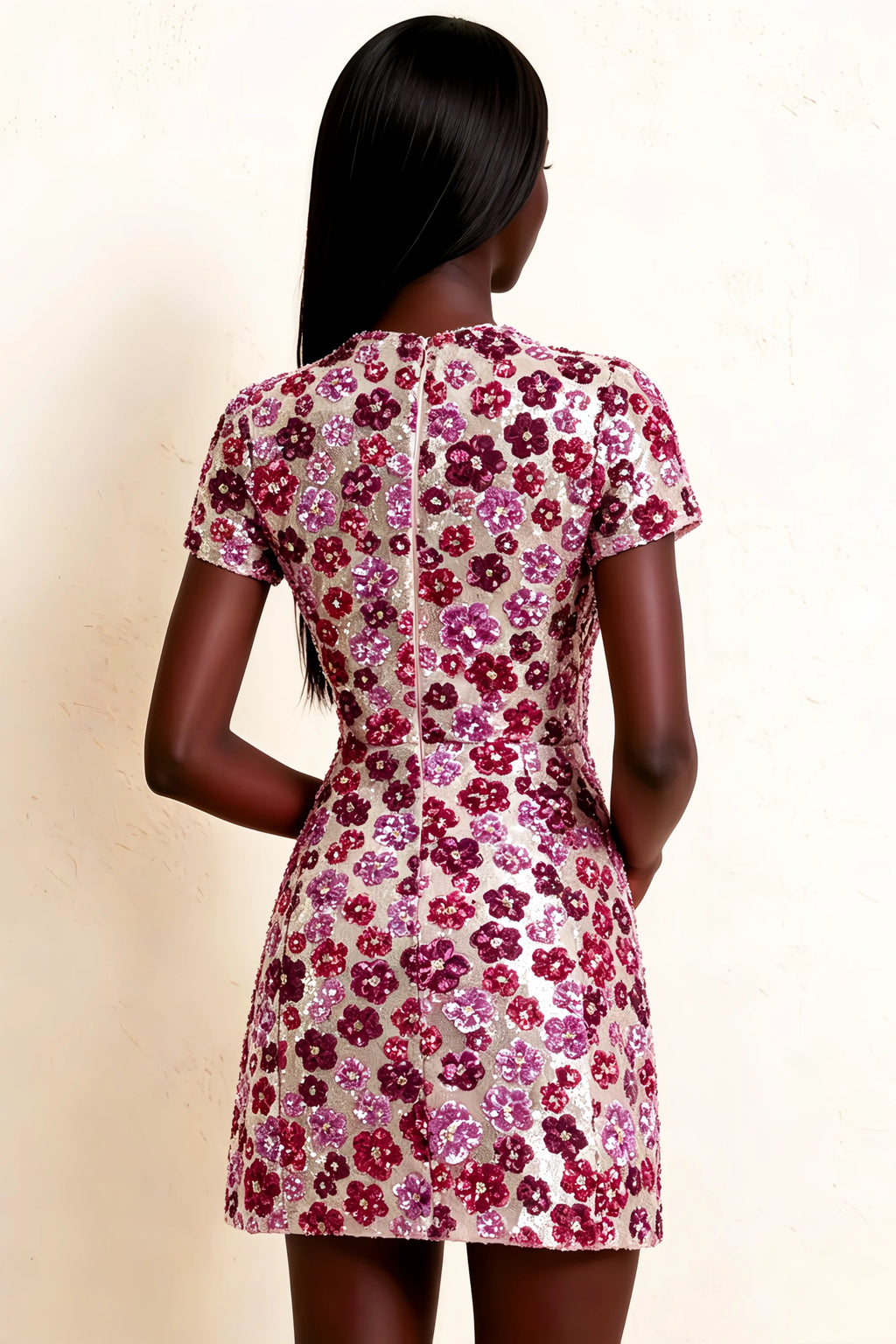 Detailed back view of LVLVS Brooke pink floral sequin mini dress showing vertical seam detail and zipper closure, perfect for semi-formal occasions