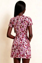 Detailed back view of LVLVS Brooke pink floral sequin mini dress showing vertical seam detail and zipper closure, perfect for semi-formal occasions