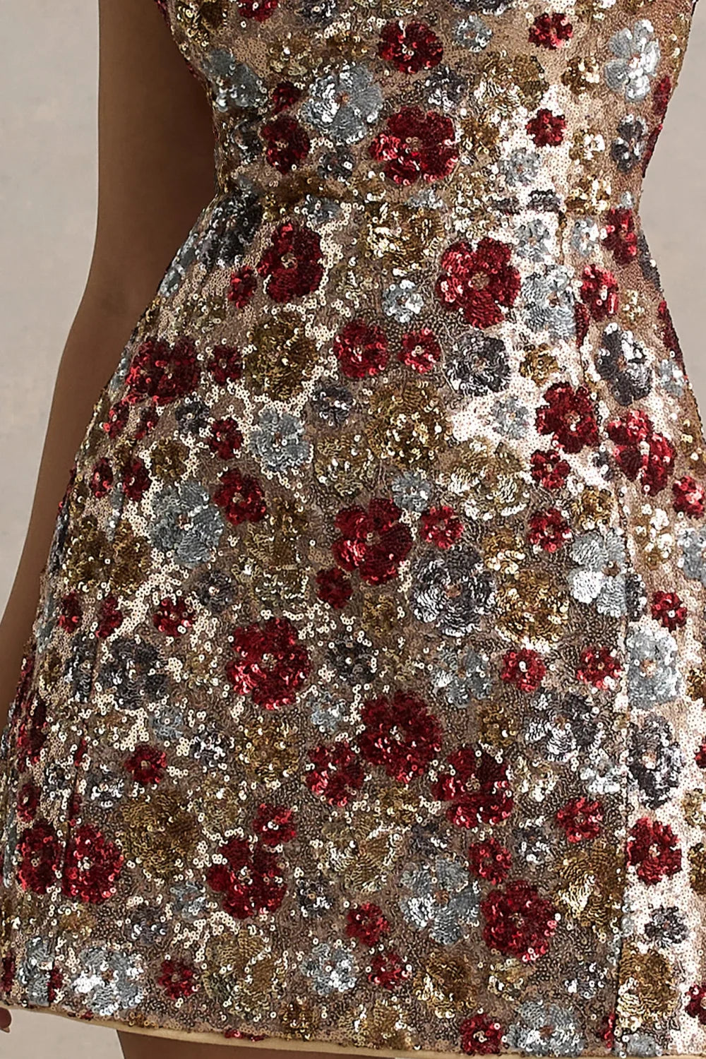 Close up of the flared mini skirt on LVLVS Brooke red floral sequin embroidery dress, showcasing intricate beadwork and shimmering effect, perfect for evening party or special occasion