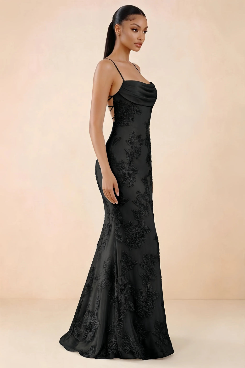 Three-quarter studio view of Brynn black dress showing the fitted hips and flared long hem