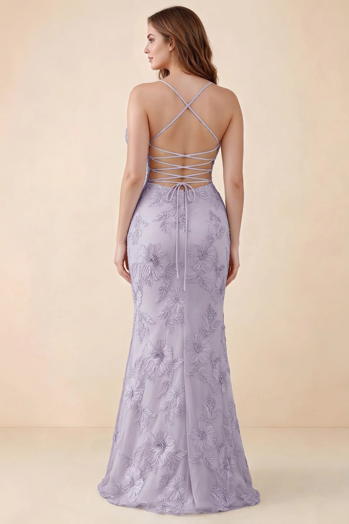 Rear studio view of Brynn dusty lilac dress on a second model, showing the back lacing and floral skirt