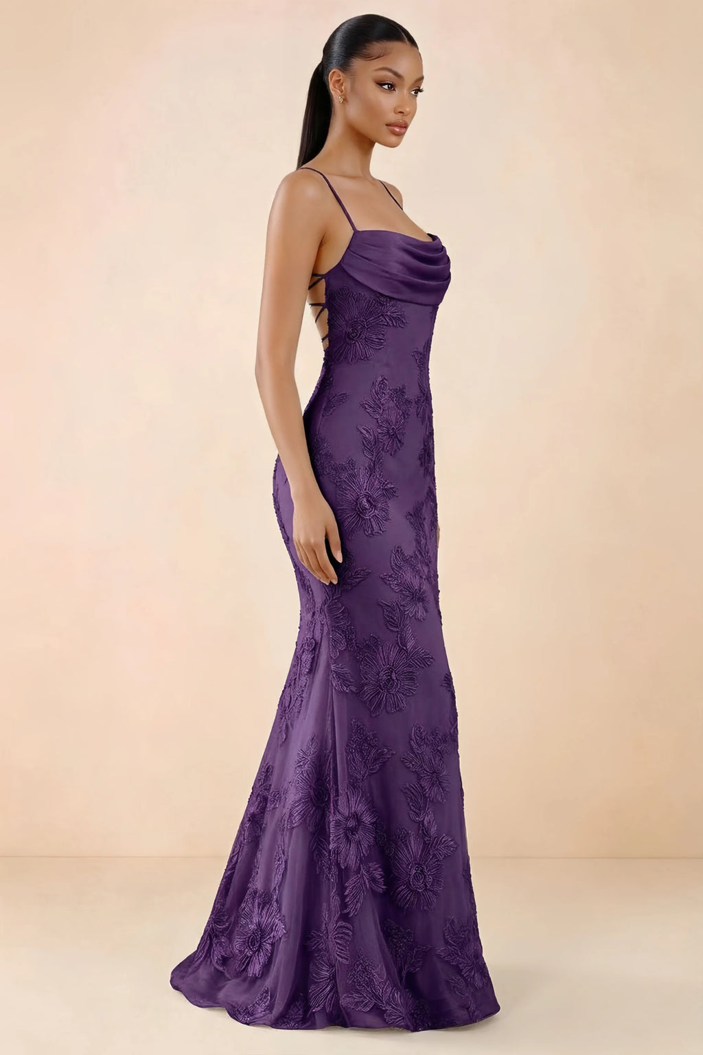 Three-quarter studio view of Brynn plum dress showing the fitted hips and flared long hem