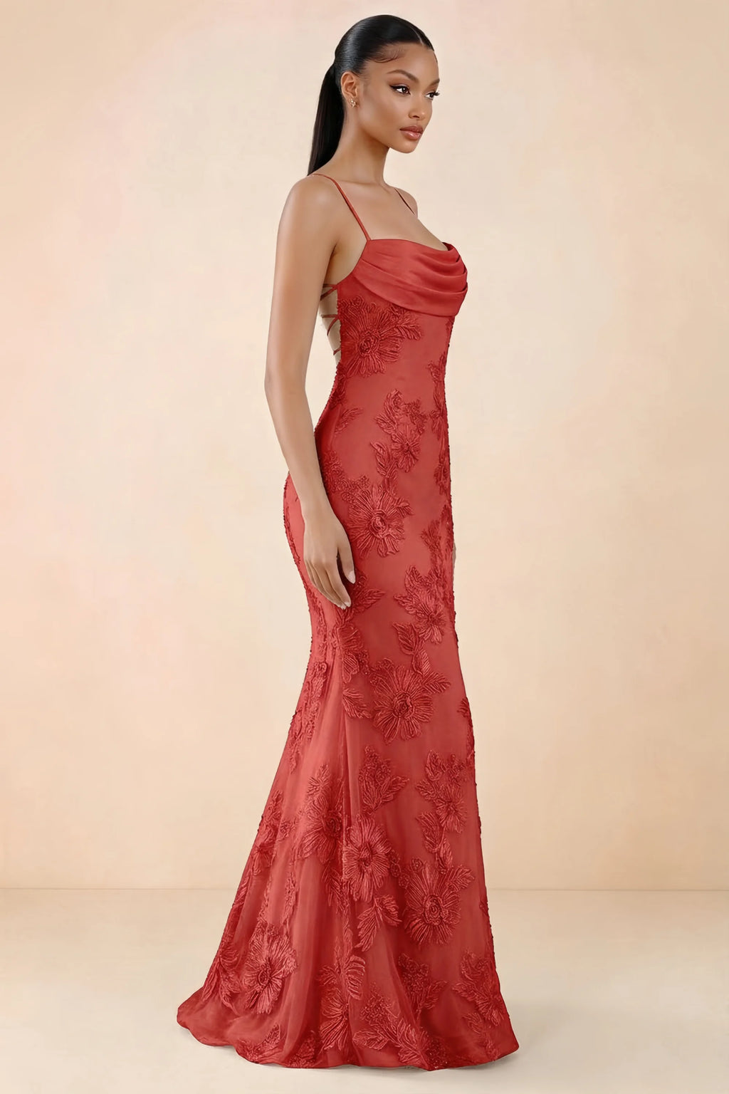 Three-quarter studio view of Brynn red dress showing the fitted hips and flared long hem
