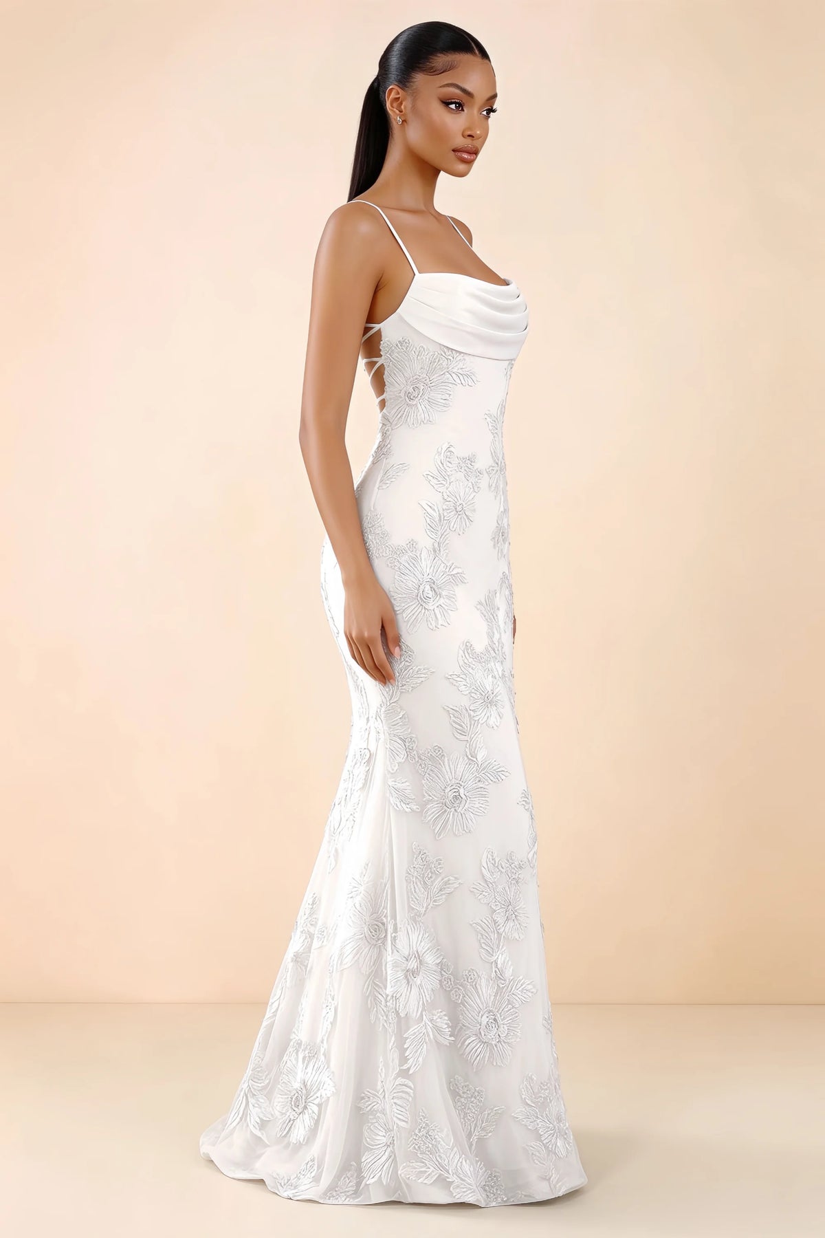 Three-quarter studio view of Brynn white dress showing the fitted hips and flared long hem