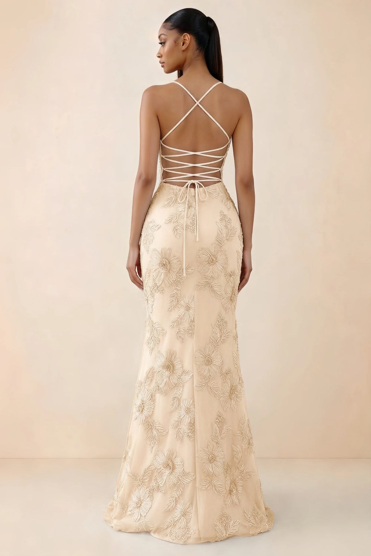 Rear studio view of Brynn yellow dress showing crossed shoulder straps and an open lace-up back
