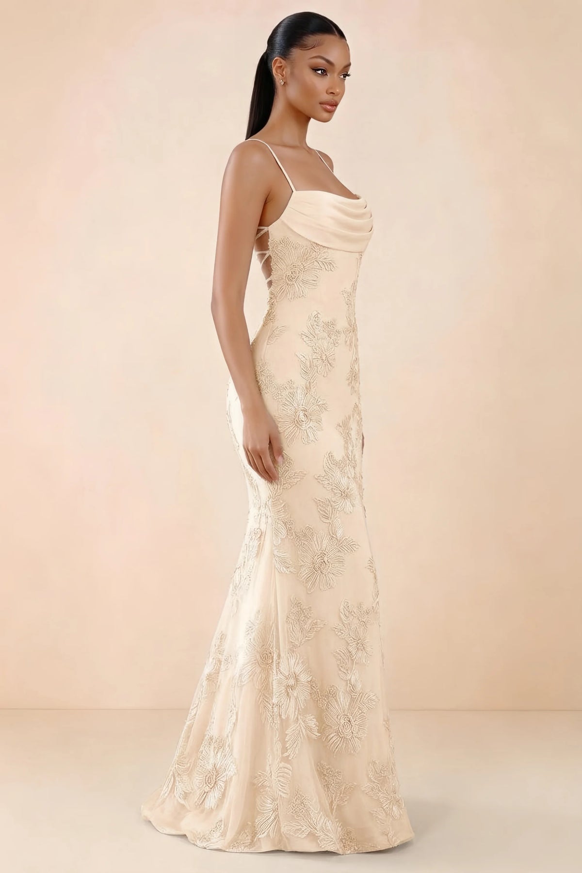 Three-quarter studio view of Brynn yellow dress showing the fitted hips and flared long hem