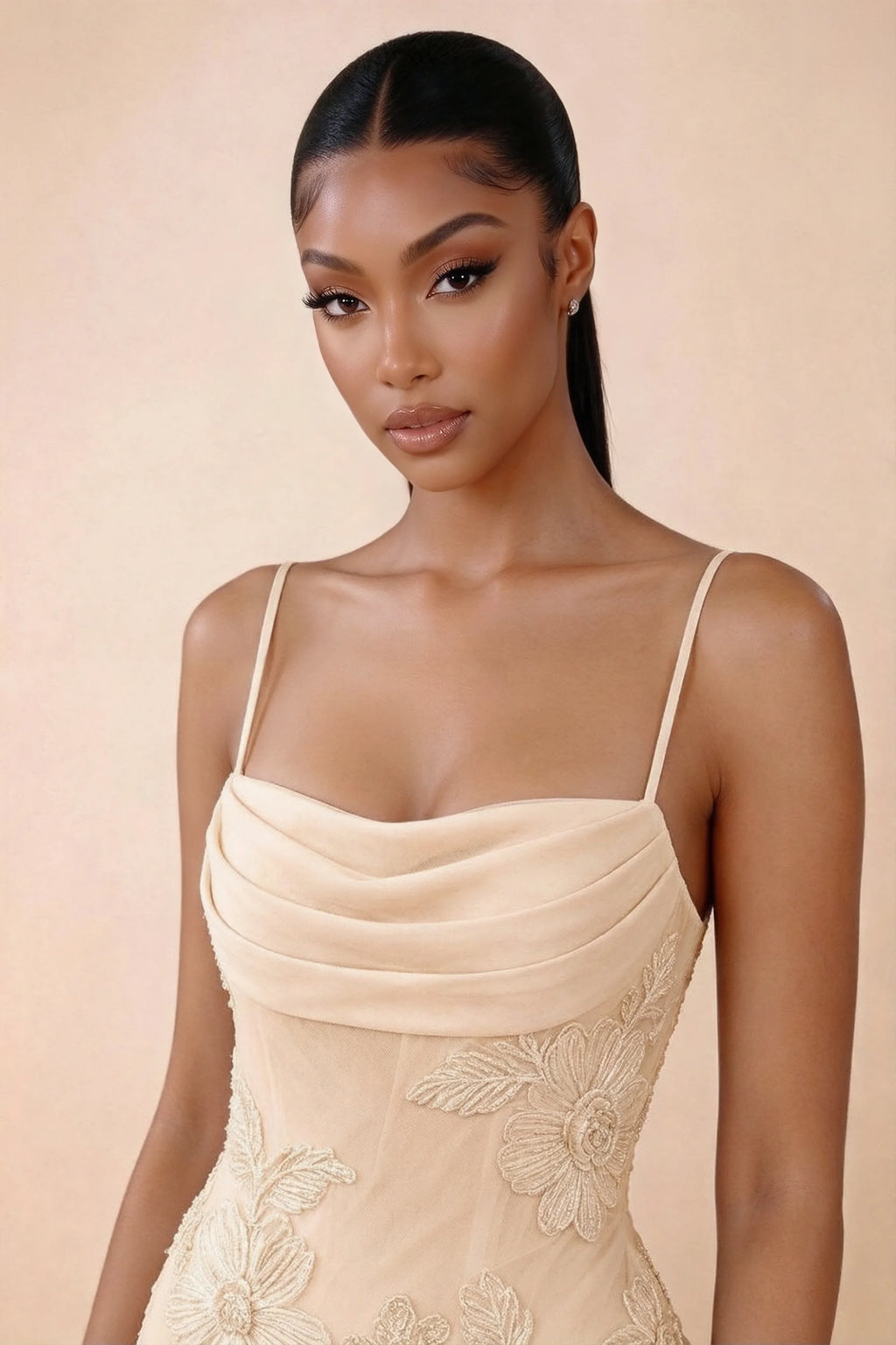 Close-up of Brynn yellow draped cowl neckline, thin shoulder straps and floral bodice