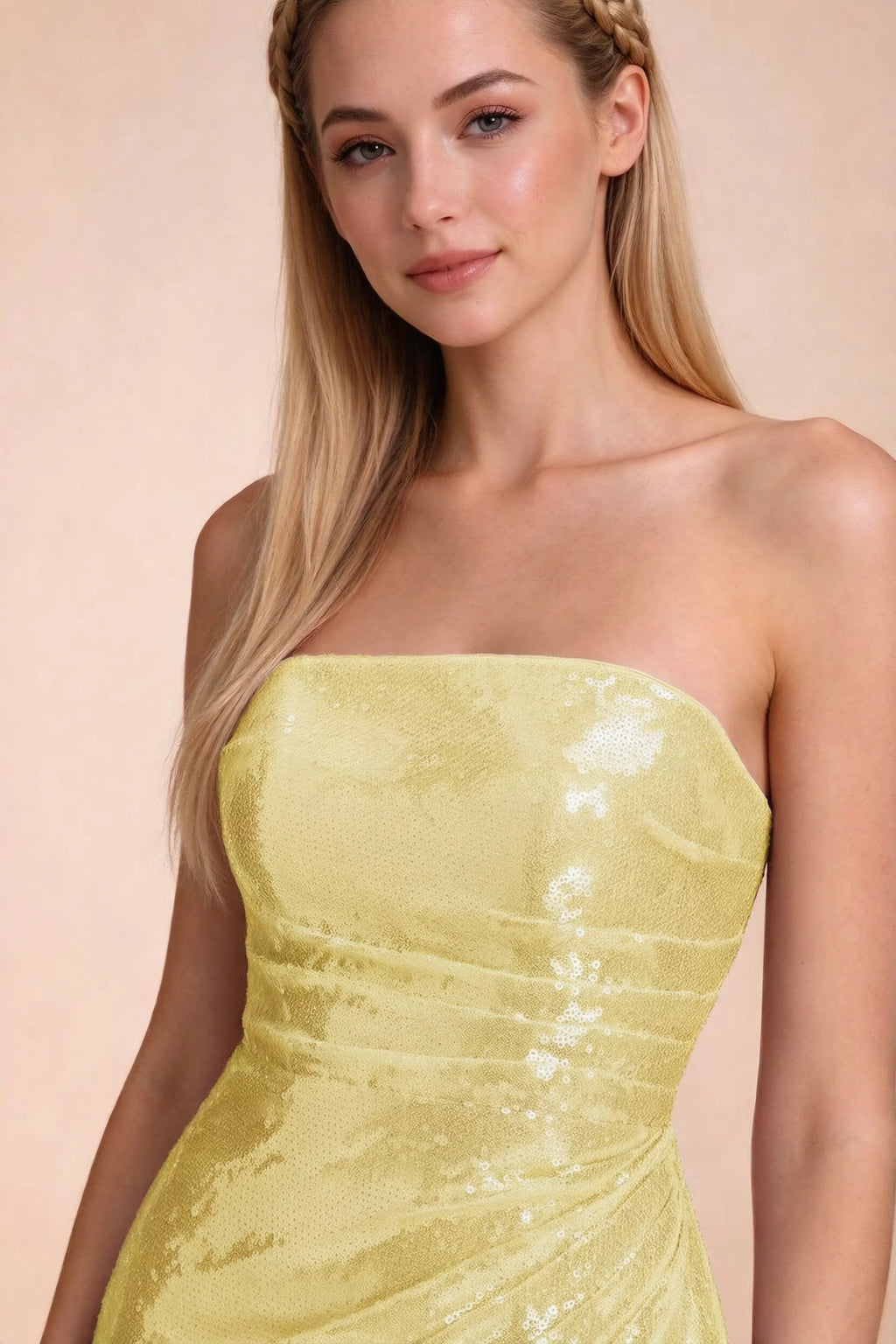 Close-up of Calista lemon straight strapless neckline and reflective sequin bodice