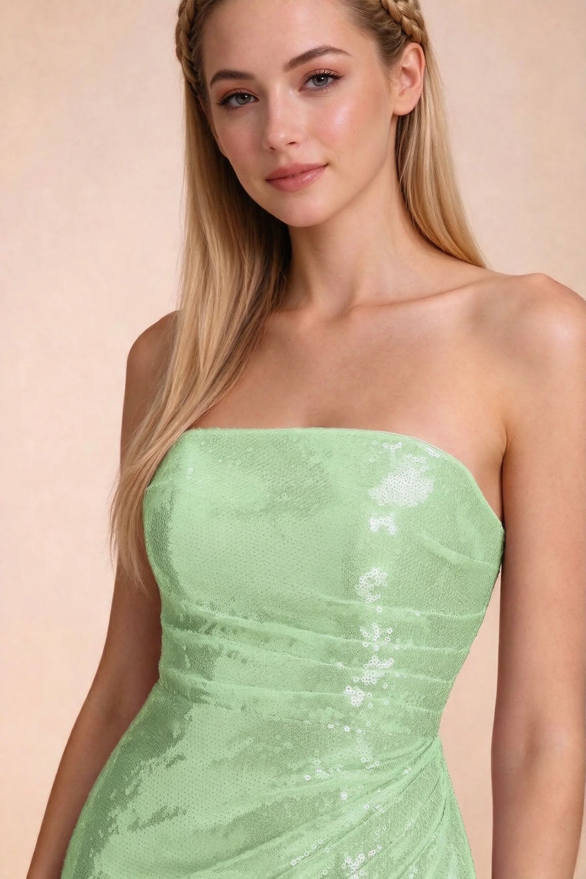 Close-up of Calista light green straight strapless neckline and reflective sequin bodice