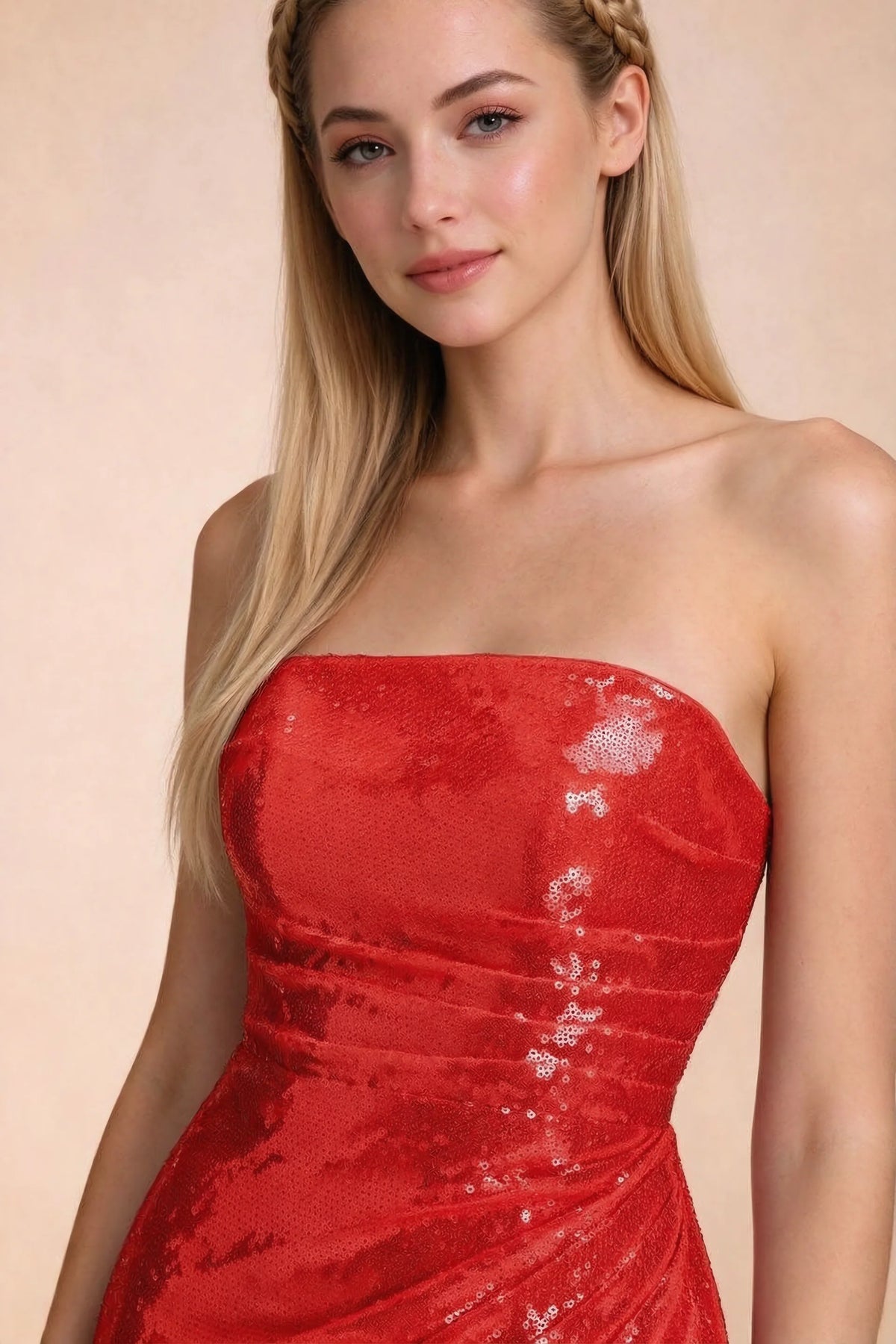 Close-up of Calista red straight strapless neckline and reflective sequin bodice