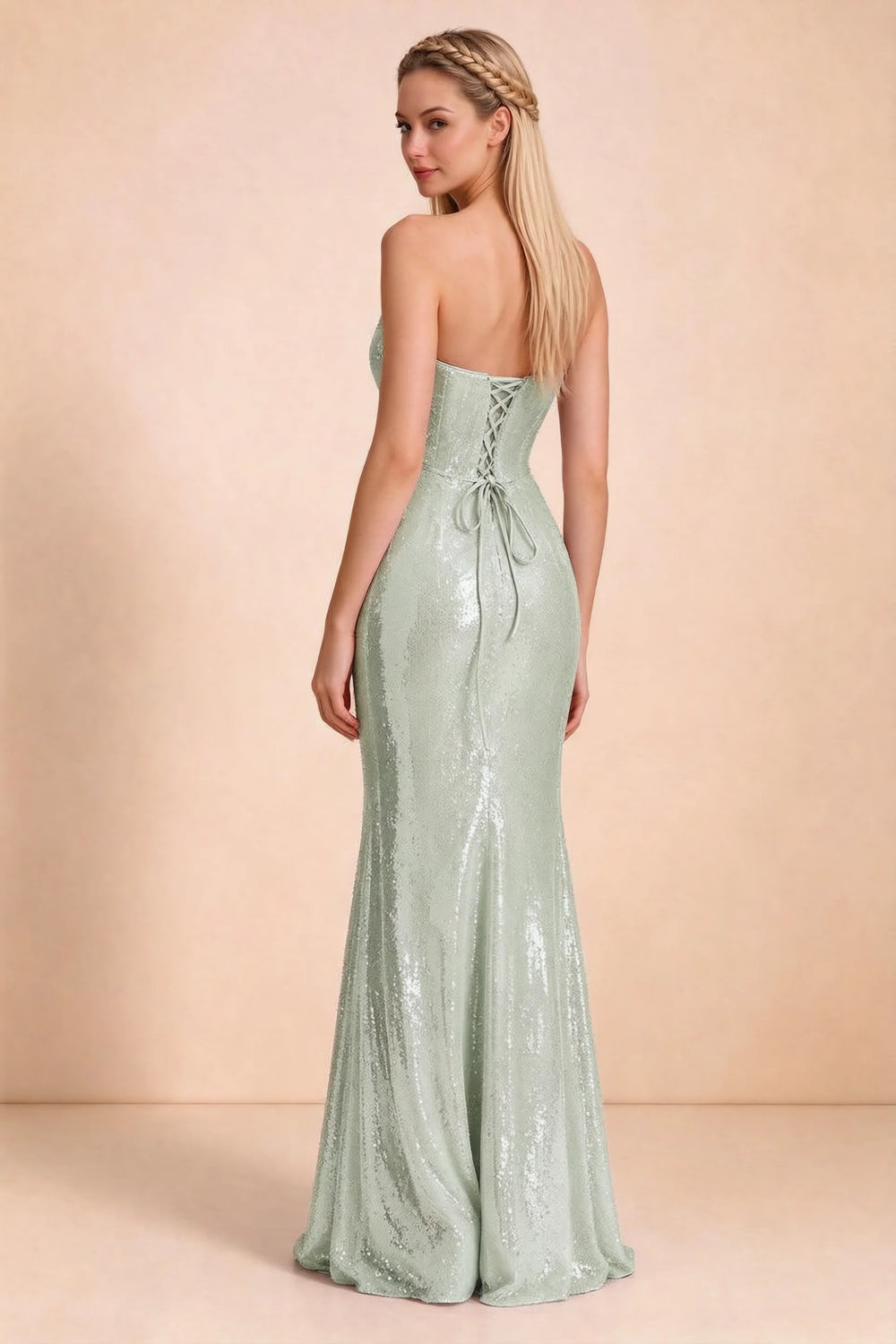 Translation missing: en.Rear three-quarter studio view of Calista sage green dress showing the centre-back lacing and long skirt content.product_image_secondary