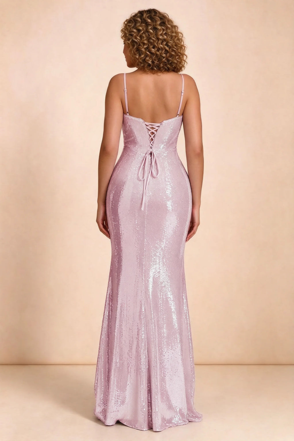 Rear studio view of Callie dusty pink dress on a second model, showing the back lacing and sequin skirt
