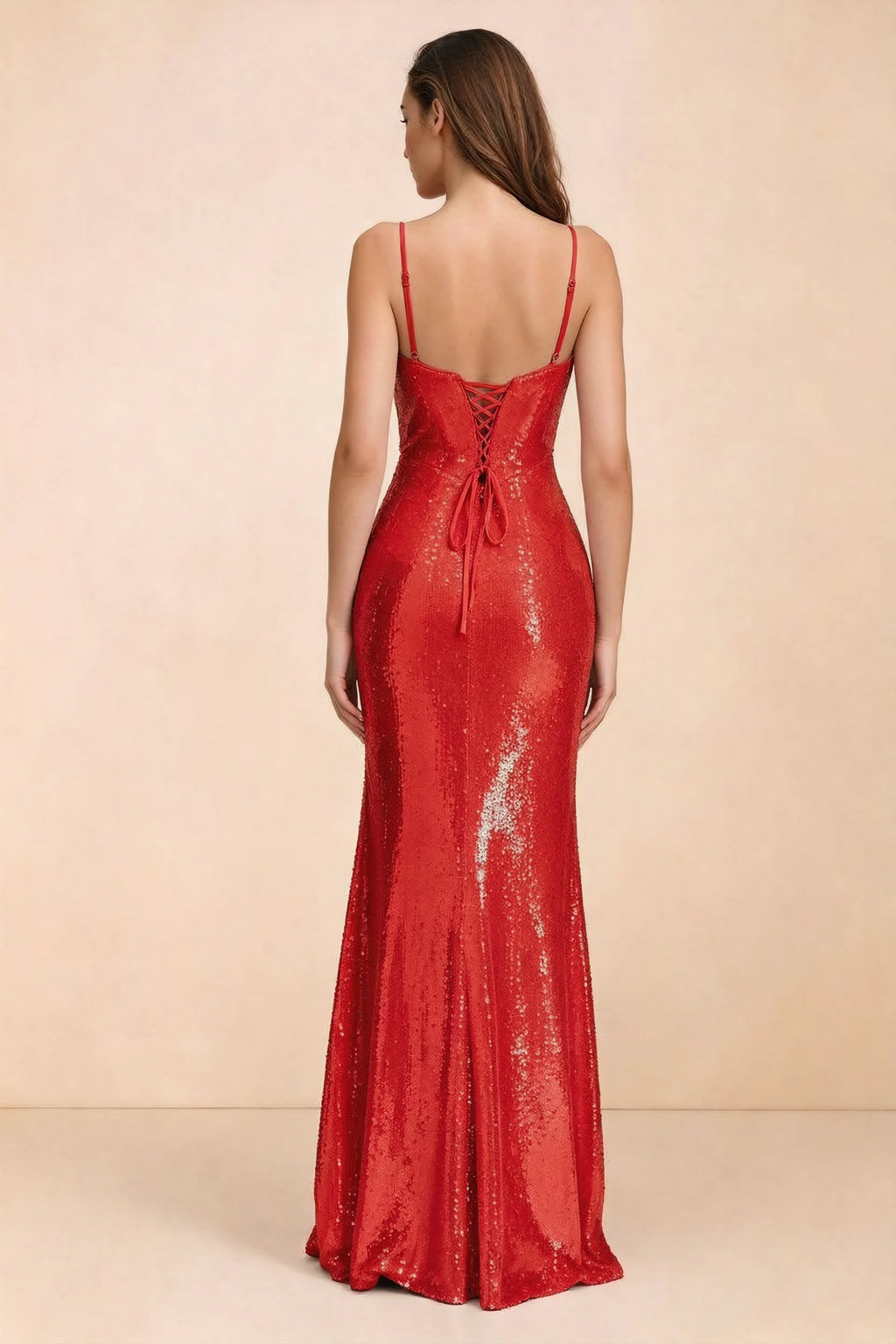 Rear three-quarter studio view of Callie red dress showing the centre-back lacing and mermaid skirt