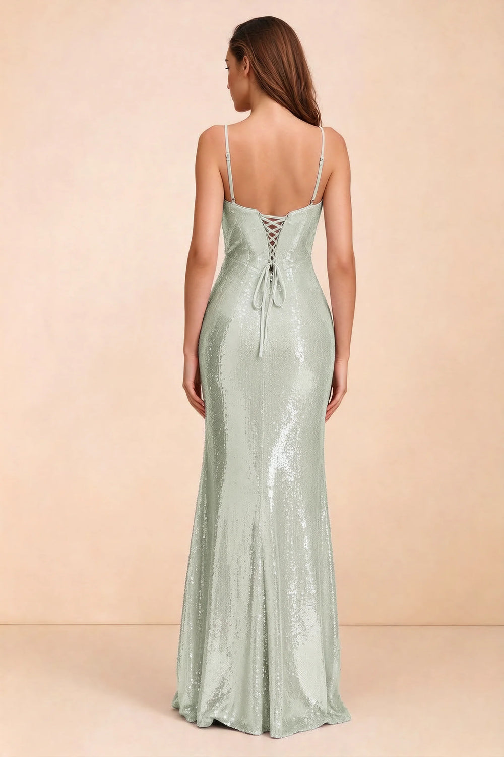 Translation missing: en.Rear three-quarter studio view of Callie sage green dress showing the centre-back lacing and mermaid skirt content.product_image_secondary